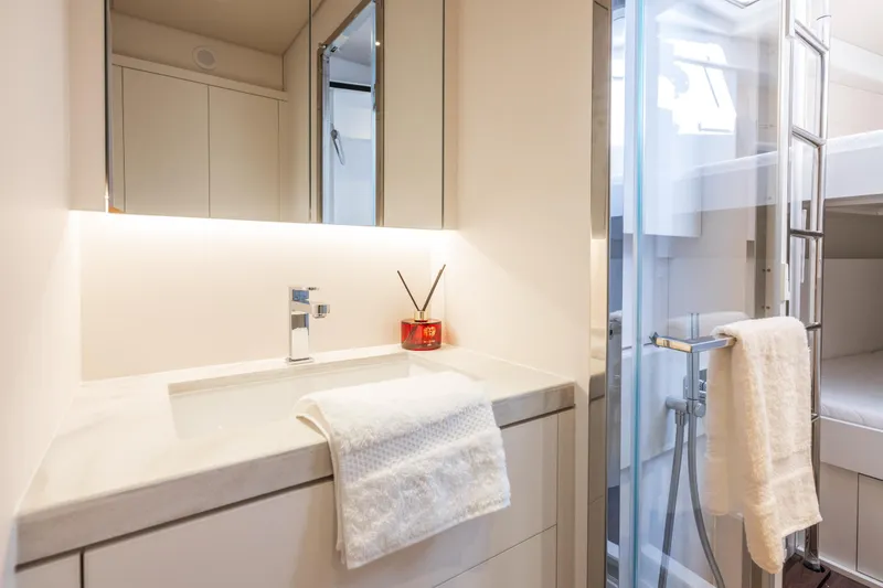 Slide: The Image of Interior of 2025 Lagoon Eighty 2 yacht with bunk beds and modern design. - 41