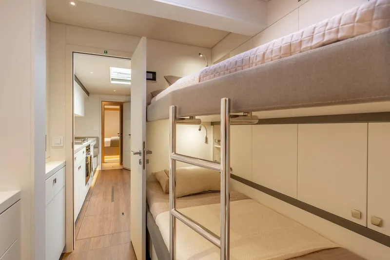 Slide: The Image of Interior of 2026 Lagoon Eighty 2 yacht with bunk beds and modern design. - 47