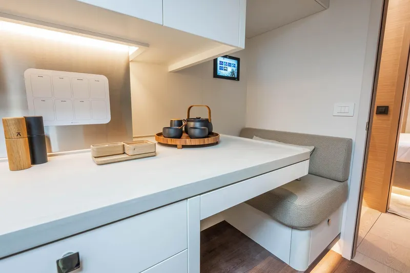 Slide: The Image of Modern interior of Lagoon Eighty 2 yacht, featuring a sleek dining area with elegant tableware. - 48