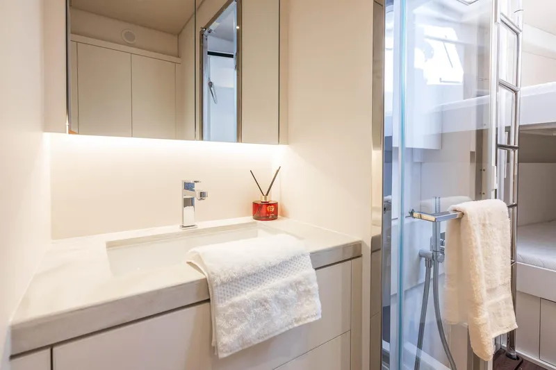 Slide: The Image of Luxurious bathroom interior of 2026 Lagoon Eighty 2 yacht with modern fixtures and elegant design. - 49