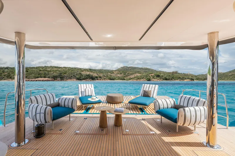 Slide: The Image of Luxurious 2025 Lagoon Eighty 2 yacht with elegant outdoor seating and scenic ocean view. - 9