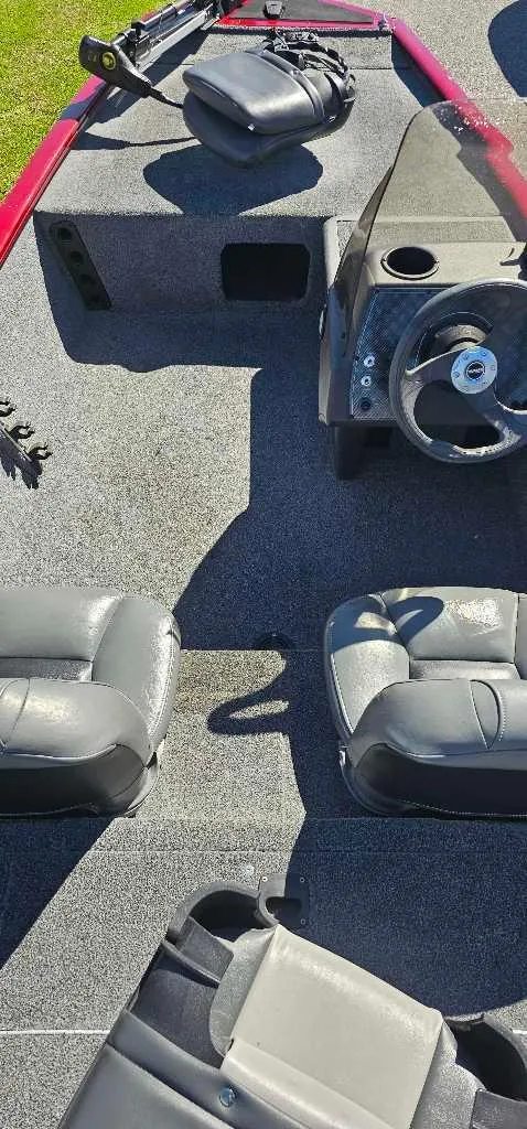 Slide: The Image of 2019 Tracker Pro 160 boat interior with seating and steering wheel. - 3