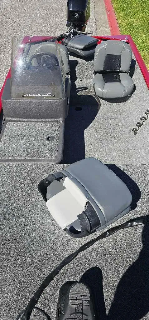 Slide: The Image of 2019 Tracker Pro 160 boat interior with seating and steering console. - 4