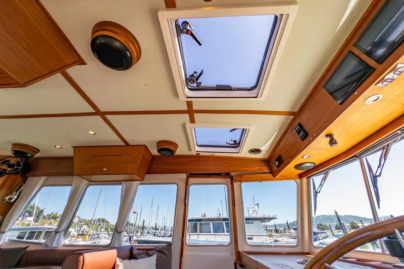 Slide: The Image of Interior of 2025 Targa 37 boat with skylights and marina view. - 17