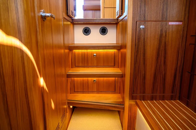 Slide: The Image of Luxurious wooden interior of 2025 Targa 37 yacht, featuring elegant steps and cabinetry. - 25