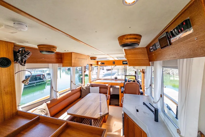 Slide: The Image of Luxurious interior of 2025 Targa 37 boat with wooden finishes and modern amenities. - 3