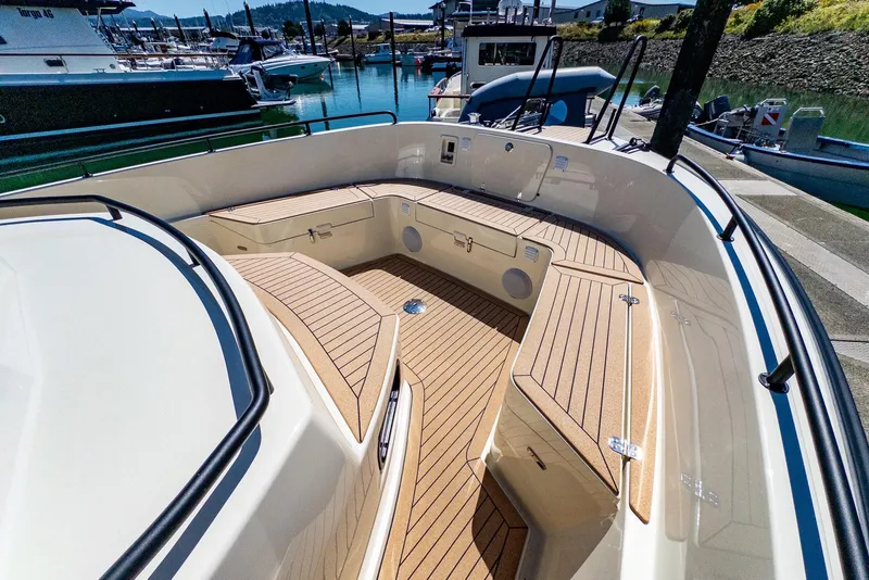 Slide: The Image of 2025 Targa 37 boat deck with wood finish, docked at marina. - 34