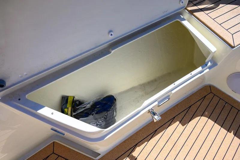 Slide: The Image of Open storage compartment on 2025 Targa 37 boat deck, showing interior space. - 36
