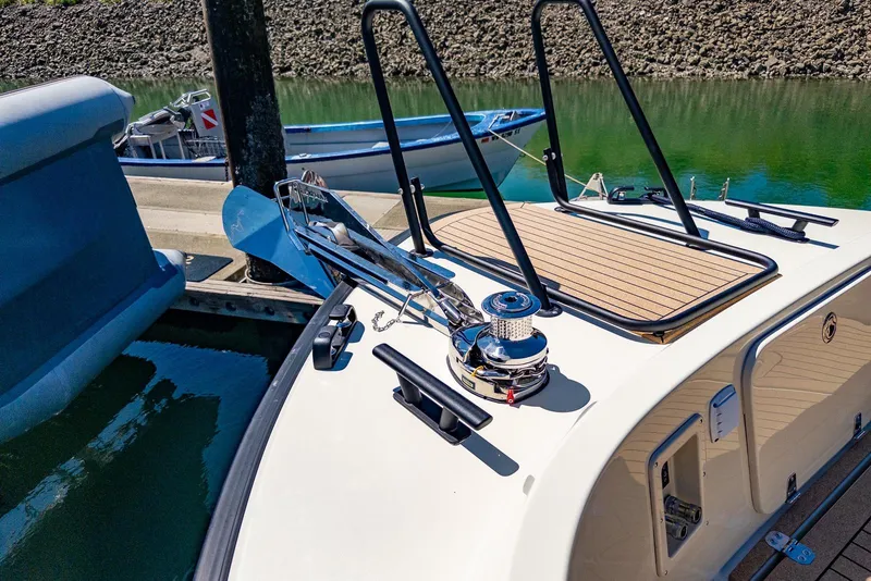 Slide: The Image of 2025 Targa 37 boat docked, featuring deck equipment and anchor system. - 38