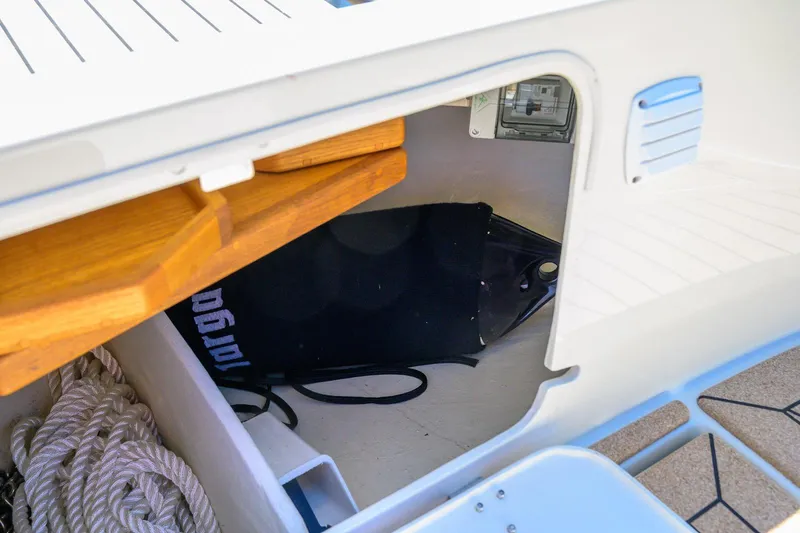 Slide: The Image of Storage compartment on a 2025 Targa 37 boat with ropes and equipment. - 41