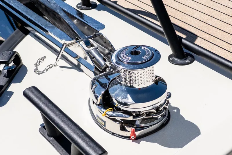 Slide: The Image of Anchor winch on 2025 Targa 37 boat deck, featuring polished metal and chain. - 43