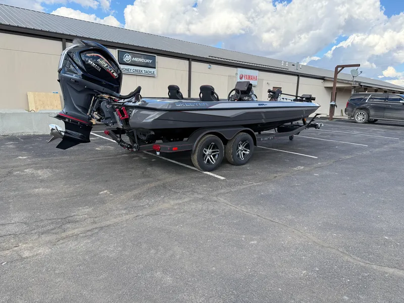 Slide: The Image of 2025 Skeeter ZXR21 boat in parking lot, featuring sleek design and powerful engine. - 5