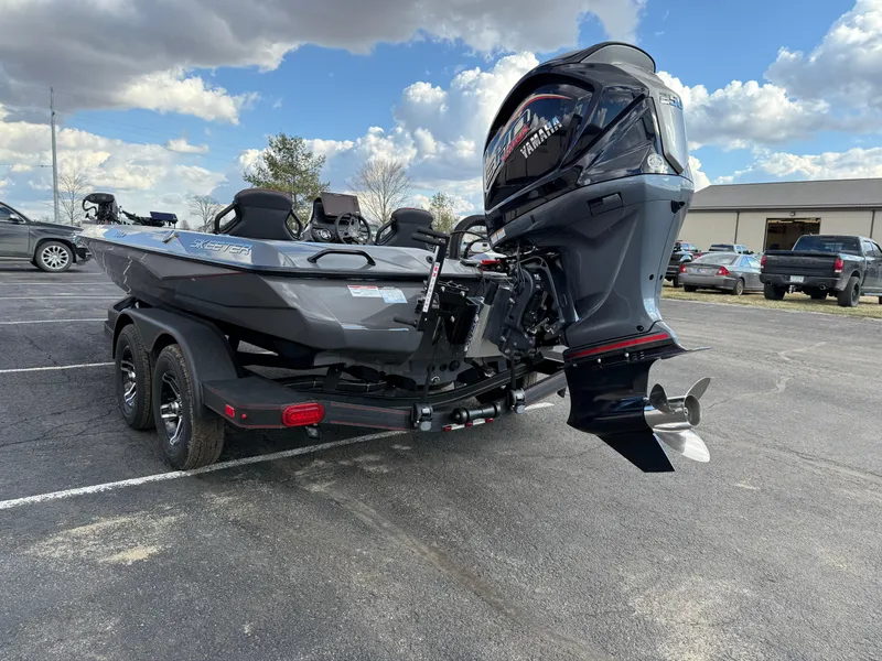 Slide: The Image of 2025 Skeeter ZXR21 boat with Yamaha outboard motor in parking lot. - 6