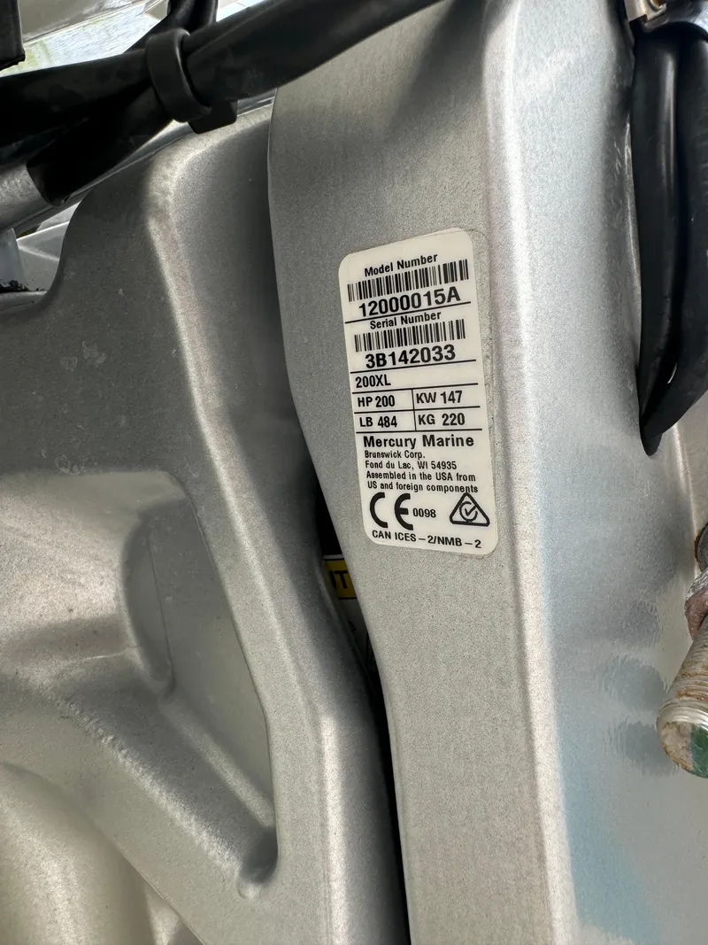 Slide: The Image of Close-up of a 2022 Sea Ray SPX 230 OB engine label with specifications. - 24