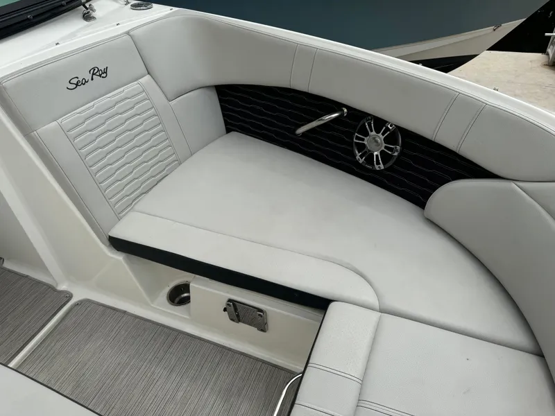 Slide: The Image of 2022 Sea Ray SPX 230 OB boat interior with white seating and speaker detail. - 8
