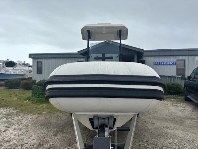 Slide: The Image of 2022 Brig Navigator 24 boat displayed outside sales office. - 12