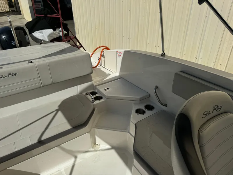 Slide: The Image of 2020 Sea Ray SPX 210 OB boat interior with seating and cup holders. - 16