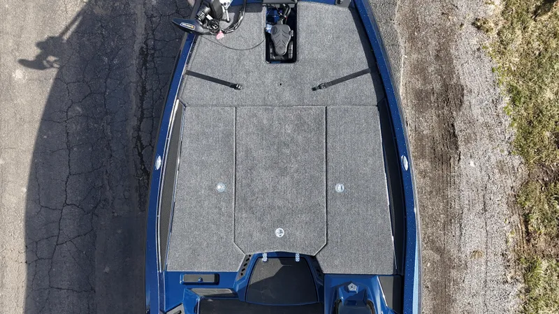 Slide: The Image of Aerial view of 2025 iKon VLX21 boat on a paved surface. - 16