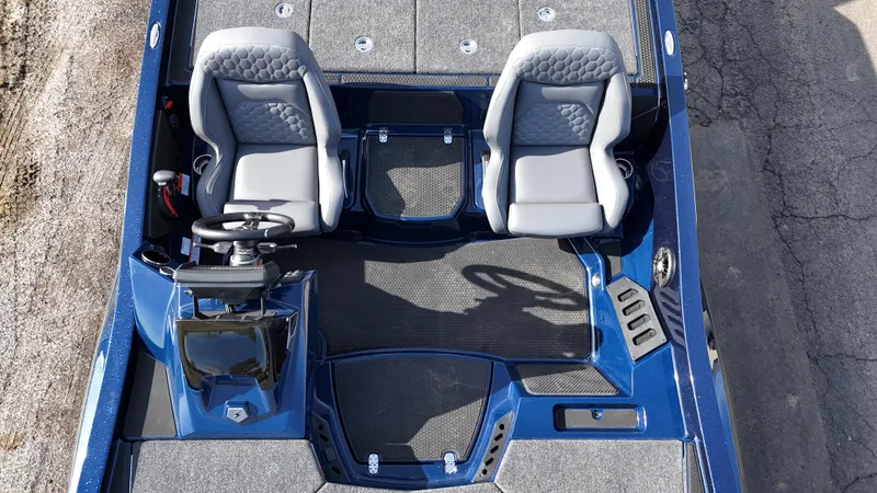 Slide: The Image of 2025 iKon VLX21 boat interior with dual seats and steering console. - 18
