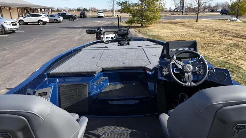 Slide: The Image of 2025 iKon VLX21 boat interior with steering console and seating. - 19