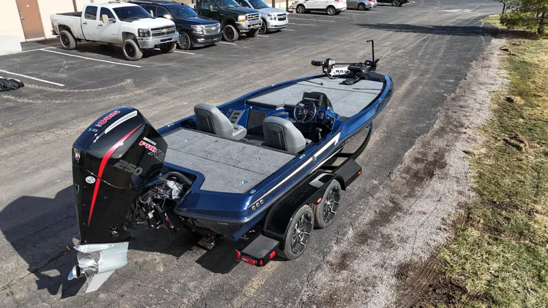 Slide: The Image of 2025 iKon VLX21 fishing boat with powerful outboard motor, parked on a trailer. - 3