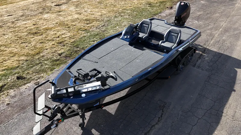 Slide: The Image of 2025 iKon VLX21 fishing boat on trailer, featuring dual seats and modern design. - 5