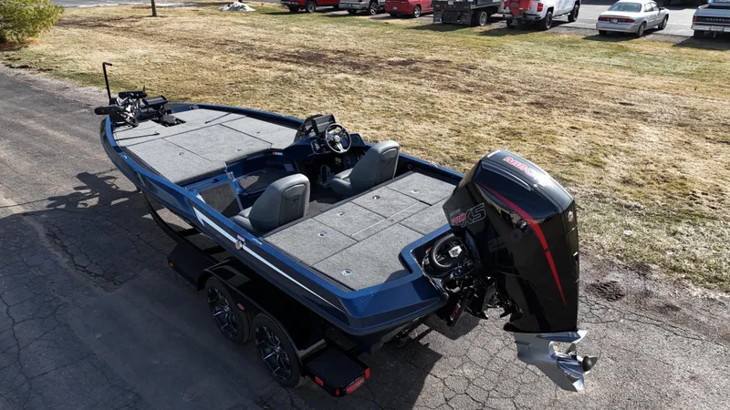 Slide: The Image of 2025 iKon VLX21 fishing boat with powerful outboard motor on a trailer. - 6