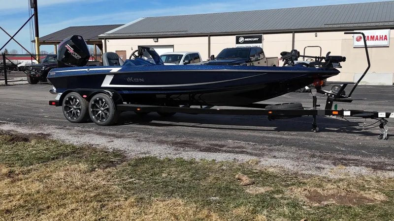 Slide: The Image of 2025 iKon VLX21 boat on trailer, parked outdoors near dealership. - 7