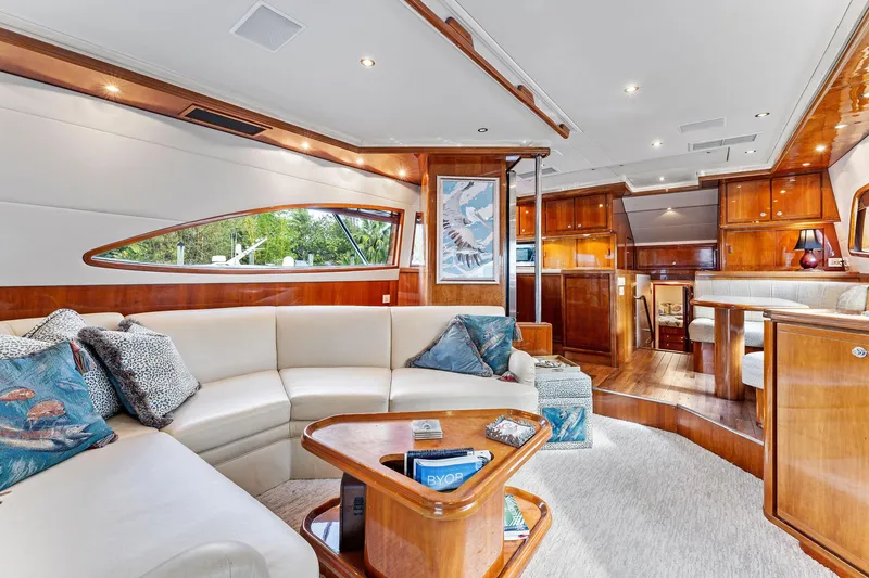 Slide: The Image of Luxurious interior of 2003 Bertram 570 Moppie yacht with elegant wood finishes. - 22