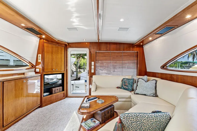 Slide: The Image of Luxurious interior of 2003 Bertram 570 Moppie yacht with elegant wood finishes and plush seating. - 25