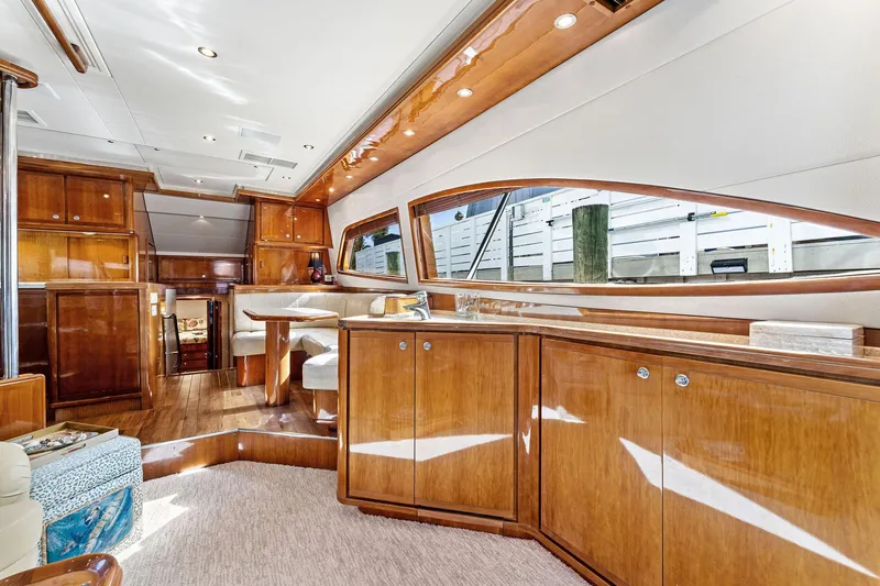 Slide: The Image of Luxurious interior of a 2003 Bertram 570 Moppie yacht with elegant wood finishes. - 27