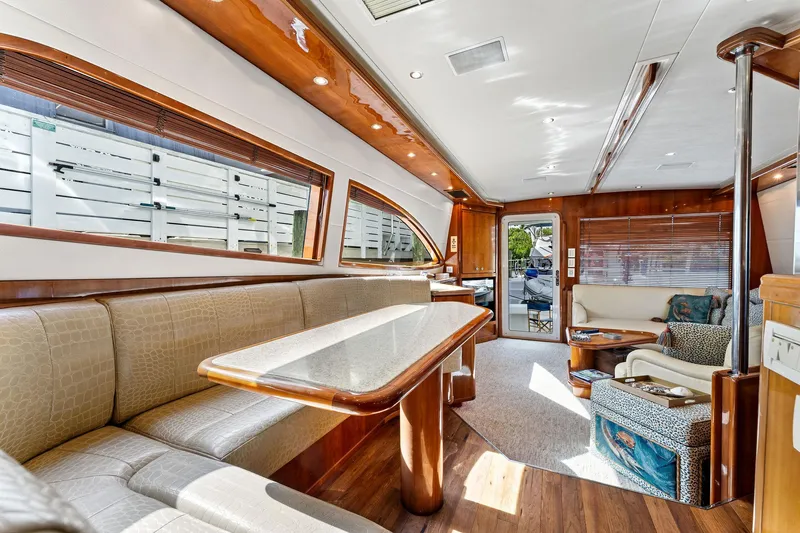 Slide: The Image of Luxurious interior of 2003 Bertram 570 Moppie yacht with elegant wood finishes. - 30
