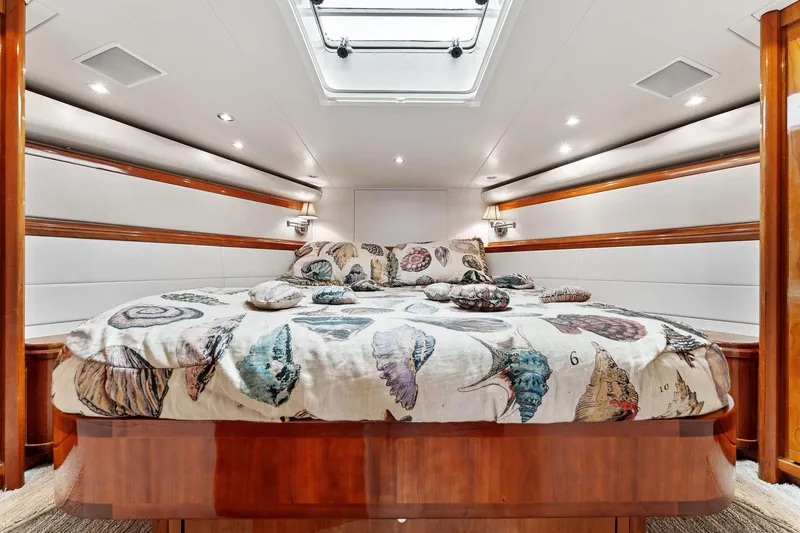 Slide: The Image of Luxurious cabin interior of 2003 Bertram 570 Moppie yacht with elegant bedding. - 37