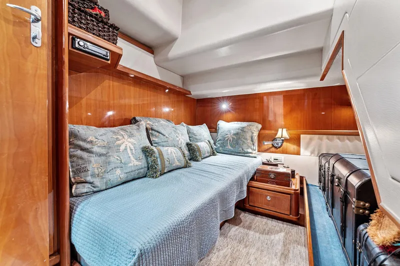 Slide: The Image of Luxurious cabin interior of 2003 Bertram 570 Moppie yacht with cozy seating and elegant decor. - 44