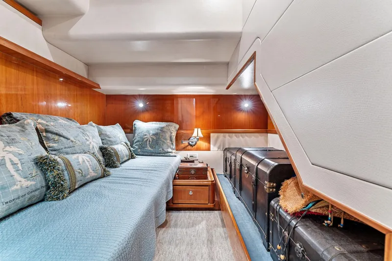 Slide: The Image of Luxurious cabin interior of 2003 Bertram 570 Moppie yacht with elegant wood paneling. - 45