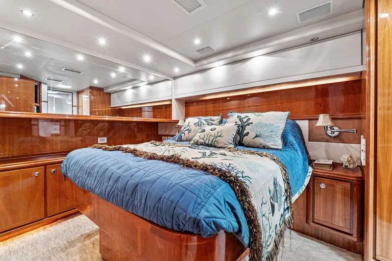 Slide: The Image of Luxurious cabin interior of 2003 Bertram 570 Moppie yacht with elegant wood finish. - 46