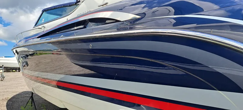 Slide: The Image of 2018 Formula 400 Super Sport boat with sleek blue and red design. - 12
