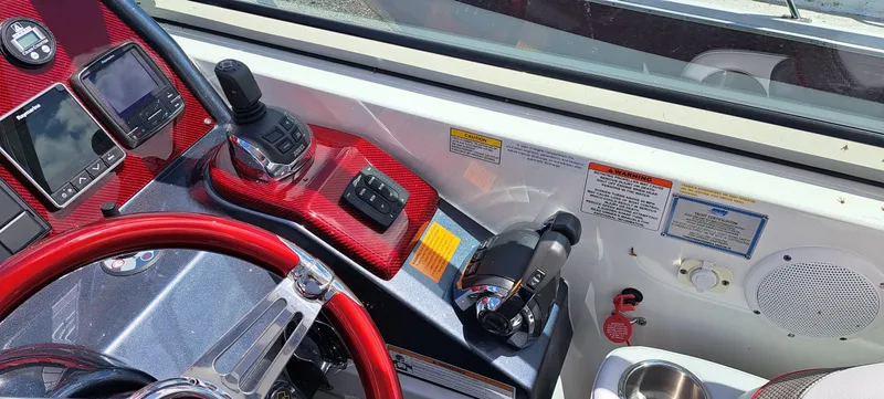 Slide: The Image of Control panel of a 2018 Formula 400 Super Sport boat with red accents. - 22