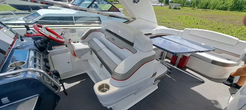 Slide: The Image of 2018 Formula 400 Super Sport boat interior with seating and steering wheel. - 23