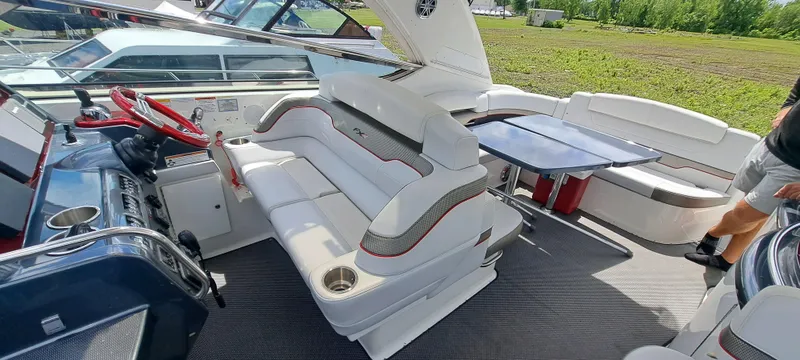 Slide: The Image of 2018 Formula 400 Super Sport boat interior with white seating and modern dashboard. - 24