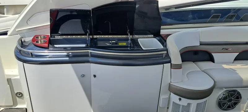 Slide: The Image of 2018 Formula 400 Super Sport yacht interior with seating and kitchenette. - 27