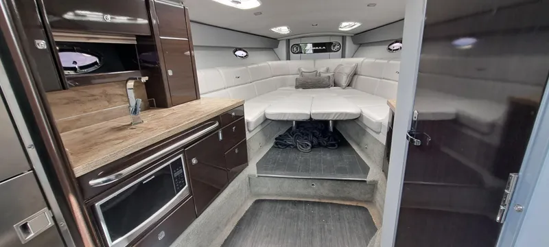 Slide: The Image of Interior of 2018 Formula 400 Super Sport yacht with modern kitchen and cozy seating area. - 30