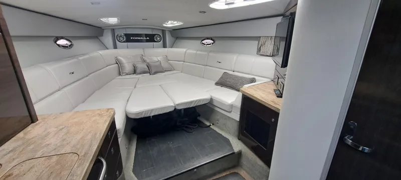 Slide: The Image of Interior of 2018 Formula 400 Super Sport boat with luxurious seating and modern amenities. - 31