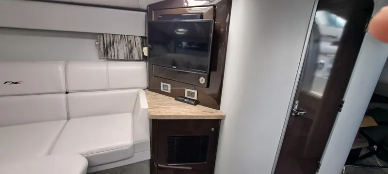 Slide: The Image of Interior of 2018 Formula 400 Super Sport with TV and white seating. - 35