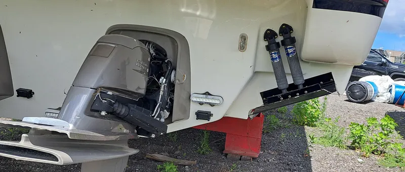 Slide: The Image of 2018 Formula 400 Super Sport boat engine and trim tabs on display. - 47