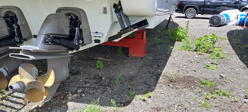 Slide: The Image of 2018 Formula 400 Super Sport boat on land, showing propellers and outboard motors. - 48