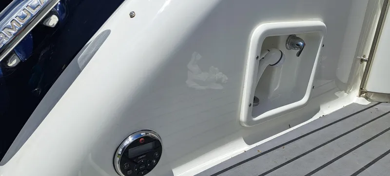 Slide: The Image of 2018 Formula 400 Super Sport boat deck with control panel and storage compartment. - 49