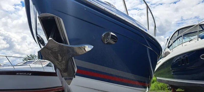 Slide: The Image of 2018 Formula 400 Super Sport boat with sleek blue hull and chrome anchor. - 5