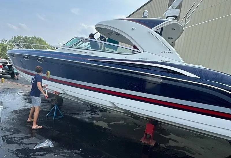 Slide: The Image of 2018 Formula 400 Super Sport boat being cleaned at a dockyard. - 1