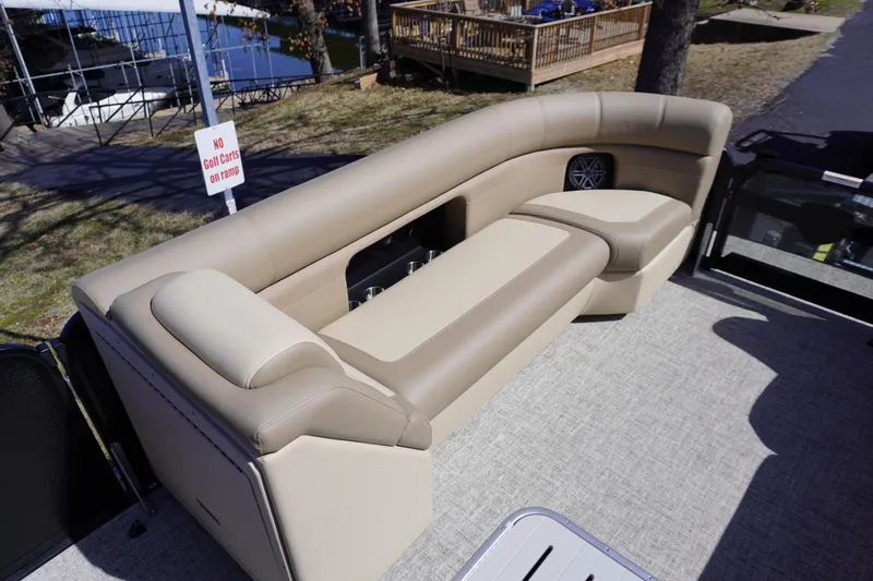 Slide: The Image of Premier 250 Sunsation RS 2025 boat interior with beige seating and speaker. - 12